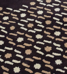 Luxury wool rug in brown with cream and tan dotted detailing
