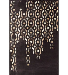 Brown hand-tufted wool rug with cascading beige and cream dot design