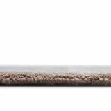 Minimalist hand-tufted rug with artistic stripe layering.