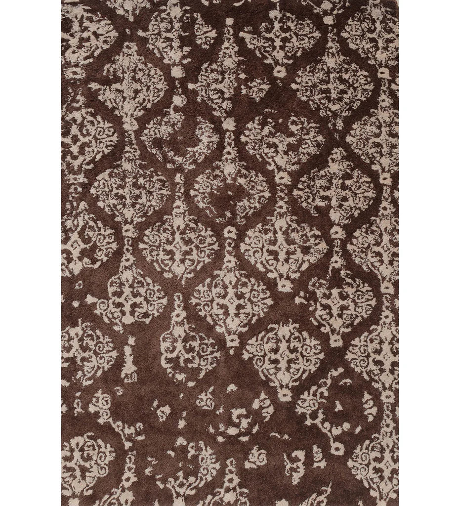 Brown and ivory hand-tufted wool rug with distressed damask design