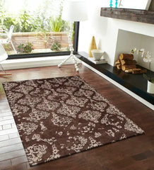 Luxury wool rug featuring chocolate brown base and ivory motifs