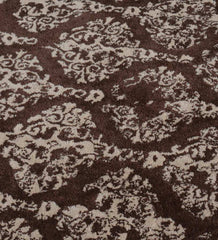 Handmade hand-tufted rug with vintage-inspired damask pattern