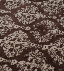 Handmade hand-tufted rug with vintage-inspired damask pattern