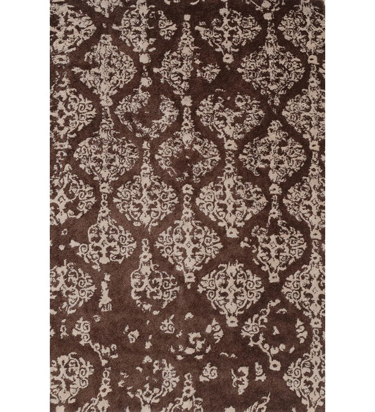 Brown and ivory hand-tufted wool rug with distressed damask design