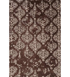 Brown and ivory hand-tufted wool rug with distressed damask design