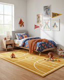 Brown and ivory basketball court novelty hand-tufted area rug placed in a kids’ room, featuring a sporty design that adds a fun and playful accent