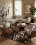 Brown modern abstract cascade design area rug with a hand-tufted finish, styled in a living room to add depth, texture, and a contemporary artistic accent
