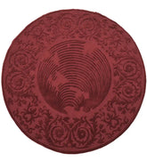 Round burgundy hand-tufted wool rug with embossed floral design