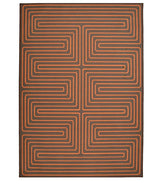 Burnt orange maze patterned rug for modern interiors.