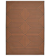 Burnt orange maze patterned rug for modern interiors.