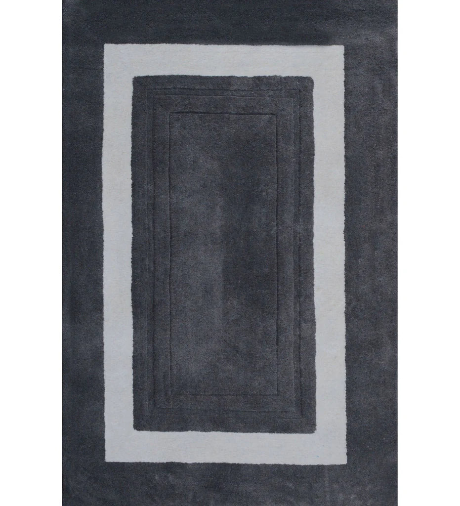 Charcoal grey bordered hand-tufted wool rug with ivory frame