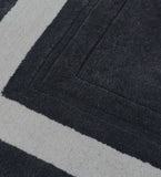 Luxury hand-tufted wool rug featuring grey center and ivory border
