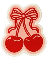 Hand-tufted cherry rug with red outline and pink bow pop art design.