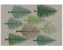 Handcrafted wool holiday rug featuring evergreen and winter trees.