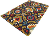 Colorful boho rug with intricate floral patterns in red, blue, gold, and white on dark background