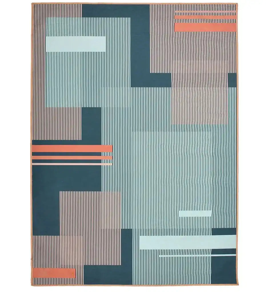 Machine washable geometric rug with blue and orange Bauhaus design in a living room, 8' x 10'