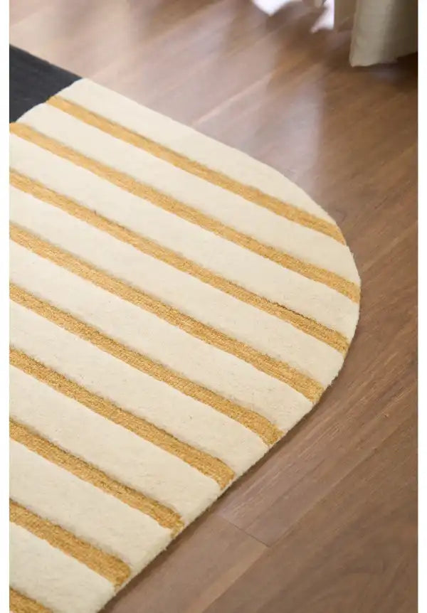 Handcrafted contemporary area rug with abstract shapes.