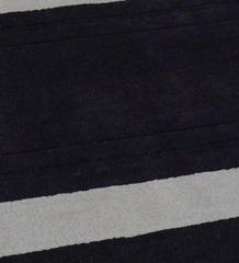 Luxury wool rug featuring plum background and ivory border