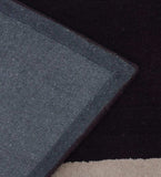 Handmade plum wool rug with ivory rectangular frame pattern