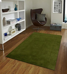 Minimalist modern rug in rich green with rectangular design