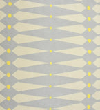 Yellow geometric diamond rug on a light gray background in a 4' x 6' size for a modern home office.