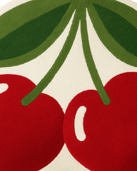 Pop-art inspired cherry rug handcrafted in premium wool.