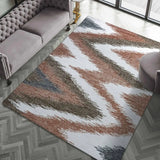 Modern rustic area rug with earthy tones and chevron pattern.