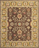 Hand-tufted floral rug with brown background and intricate yellow, red, and blue flower motifs
