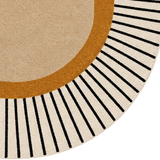 An oval area rug with a modern geometric design, featuring a large beige center, a warm ochre border, and thin black radiating lines on a cream outer edge.
