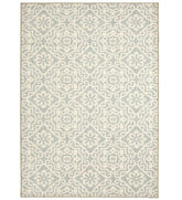 Gray geometric floral patterned rug with cream detailing.