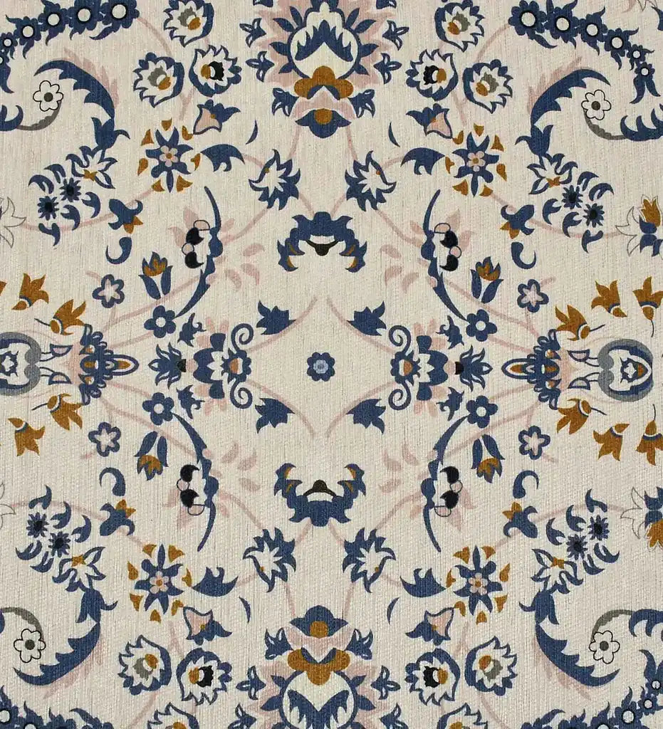 Gray medallion rug with intricate blue and gold floral pattern on a light background