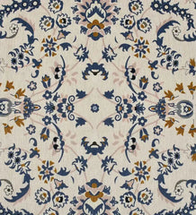 Gray medallion rug with intricate blue and gold floral pattern on a light background