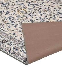 Gray medallion area rug with blue, gold, and ivory floral pattern, corner flipped