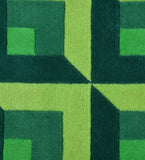 Luxury wool rug with bold geometric design in green shades