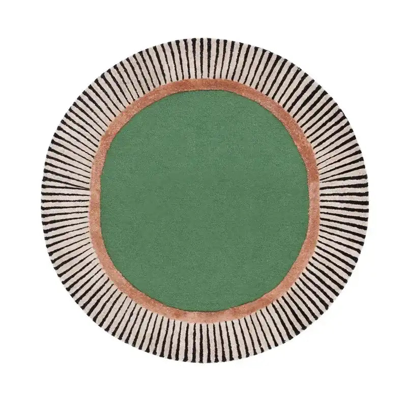 Round luxury handwoven rug with a green center, copper ring, and black-striped cream border