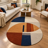 Blue and rust geometric area rug styled in a modern living room, 9x12 size