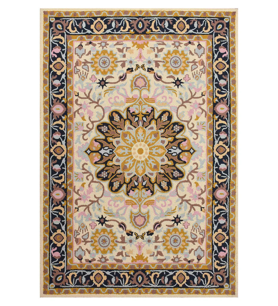 Ivory hand-tufted wool rug with golden floral medallion and navy border