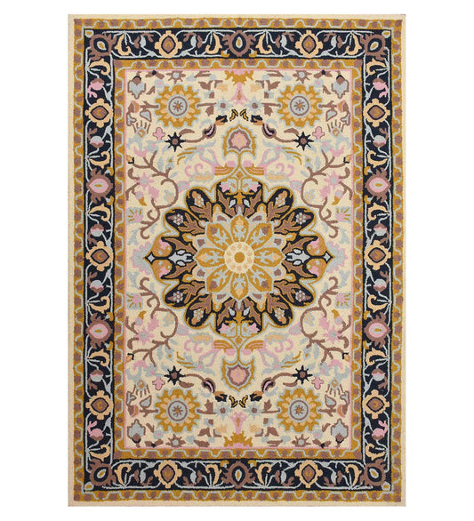 Ivory hand-tufted wool rug with golden floral medallion and navy border