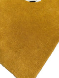 Close-up of a mustard yellow hand-tufted luxury rug by Mannat Rugs with soft texture