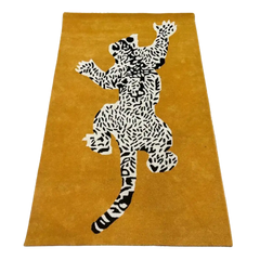 Mustard yellow hand-tufted luxury rug with black and white leopard pattern by Mannat Rugs