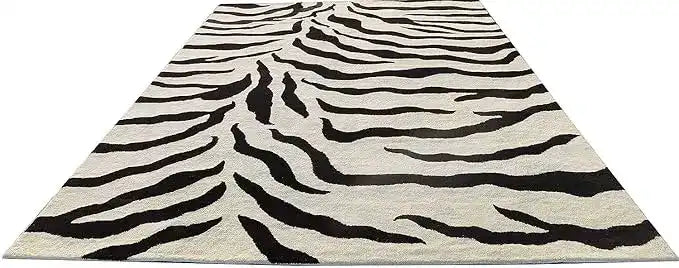 Designer wool rug with black and white zebra motif.