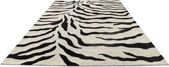 Designer wool rug with black and white zebra motif.