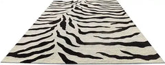 Designer wool rug with black and white zebra motif.