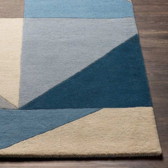 Handmade wool rug with geometric pattern for living room.
