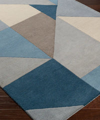 Premium hand-tufted geometric rug in blue and beige.