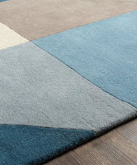 Scandinavian-style blue and taupe geometric hand-tufted rug.