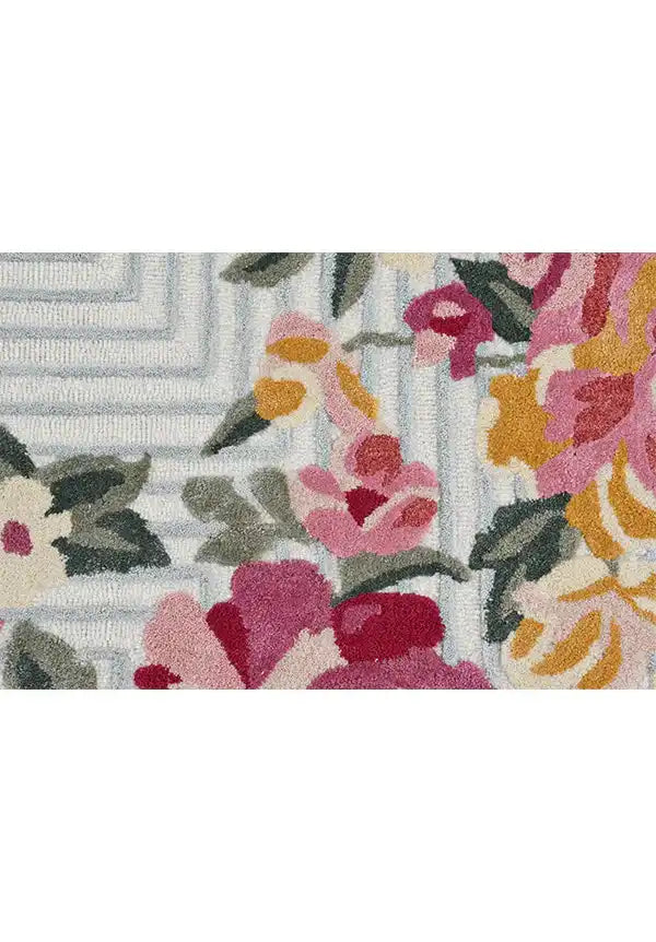 Premium wool floral rug with contemporary bloom artwork.