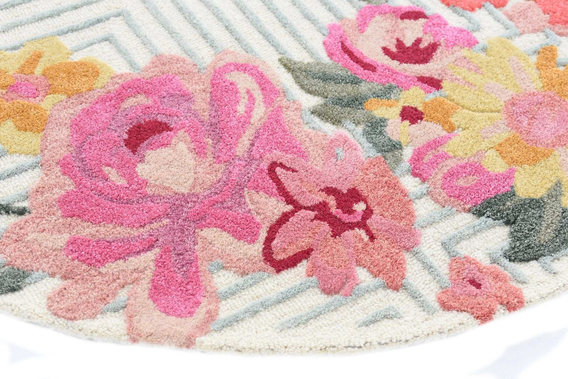 Artistic hand-tufted rug with bright multicolor flower clusters.