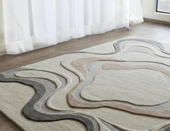 Luxury hand-tufted wool rug with abstract layered curves in neutral tones on wooden floor