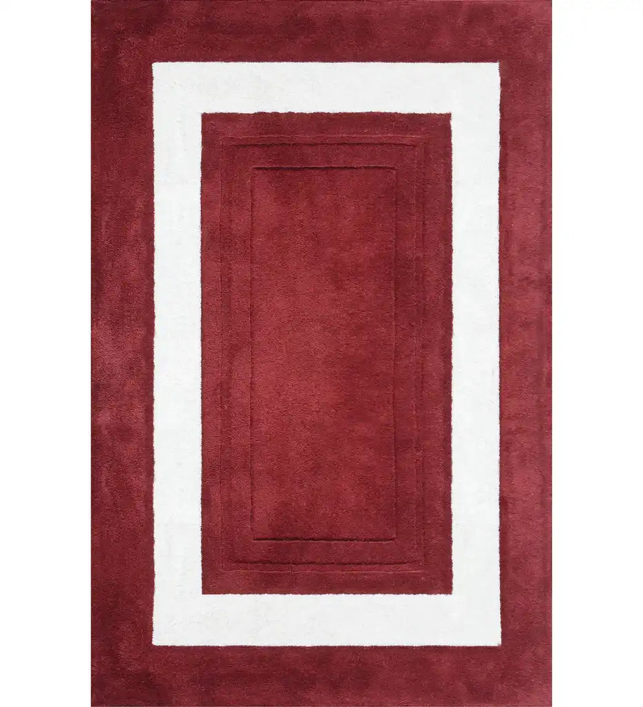 Red and white bordered hand-tufted wool rug with rectangle design